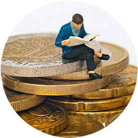 Man sitting on coins looking at documents