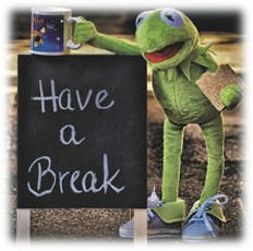 Kermit the frog standing next to a chalk board sign "Have A Break" holding a mug